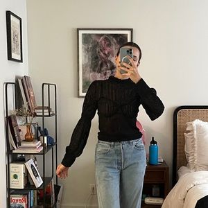 Sheer black turtle neck with ruched sleeves